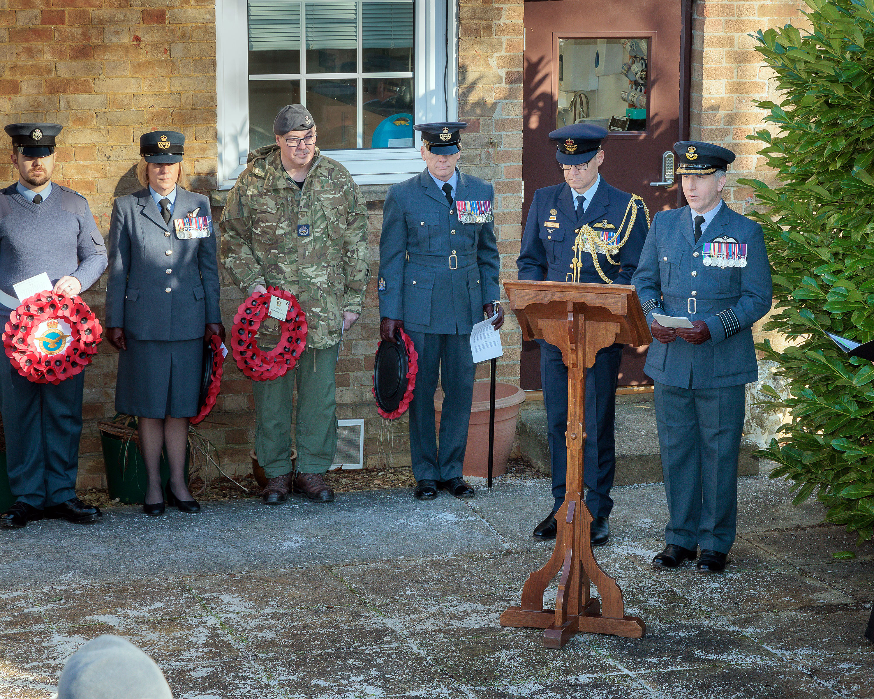 Photo depicting a gathering for the memorial service, at RAF Brize Norton, to mark 20 years since the crash of RAF C-130K Hercules XV179.